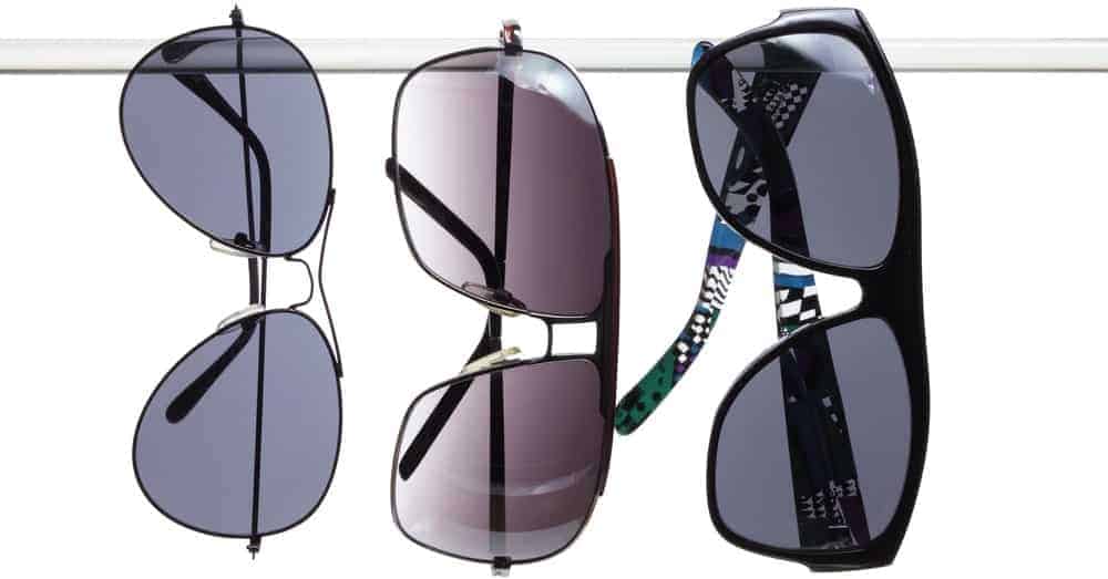 Three pairs of sunglasses with glass lenses.
