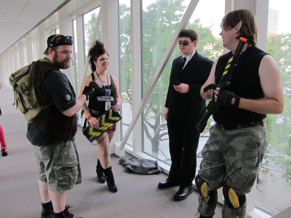 A group of friends wearing cyberpunk outfits.