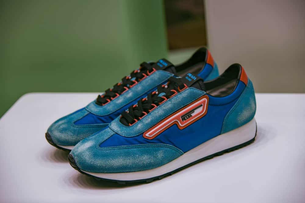A pair of colorful Prada sneakers on display.