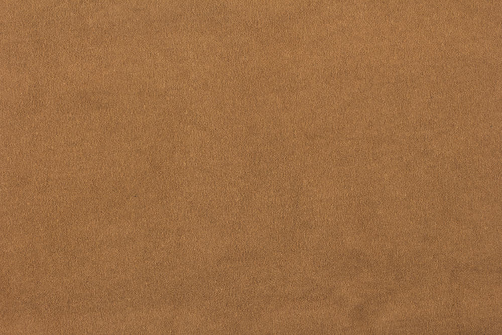 This is a close look at a suede fabric with a brown tone.