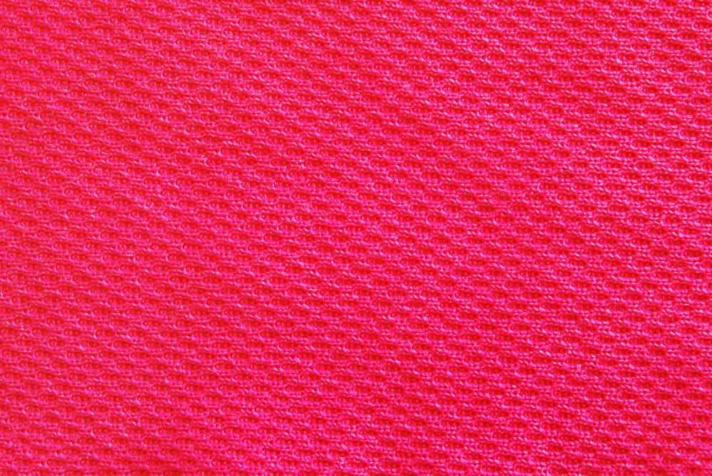 This is a close look at a bright red Interlock Knit fabric.
