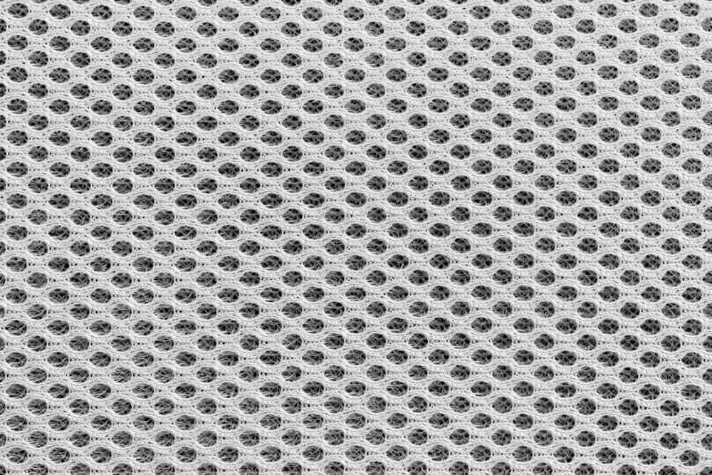 This is a close look at a white textured Mesh fabric.