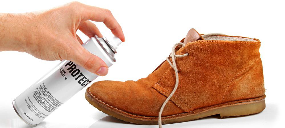 This is a close look at a man maintaining his Suede shoe.