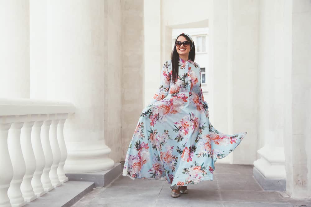 This is a woman wearing a patterned and colorful Extra-Long Summer Maxi Dress.