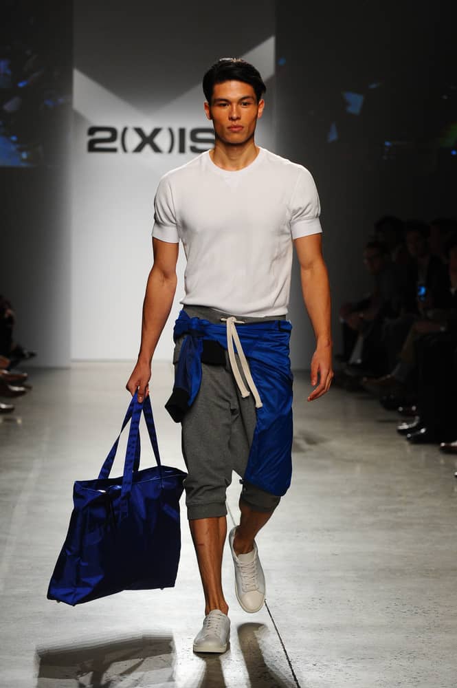 Man in an athleisure look walks the runway.