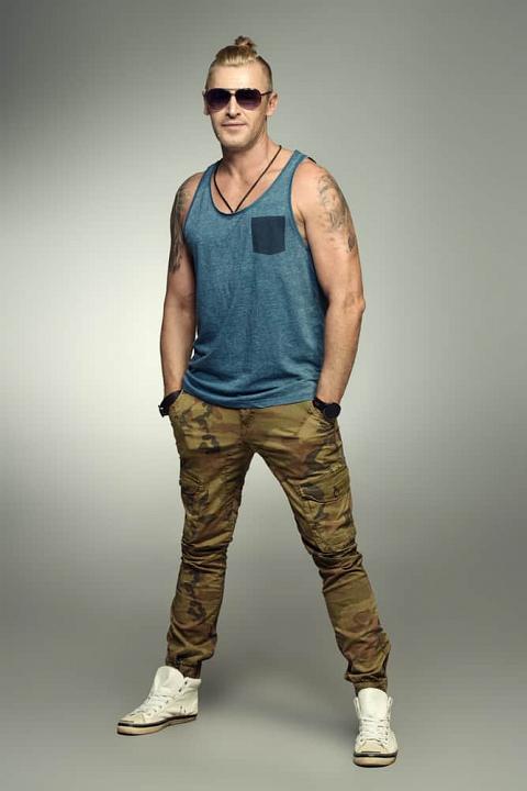 Masculine man wearing a military style clothes.