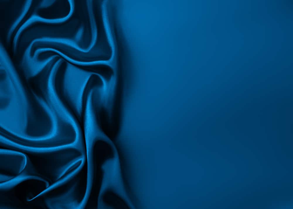 This is a close look at a dark blue rayon and silk velvet fabric.