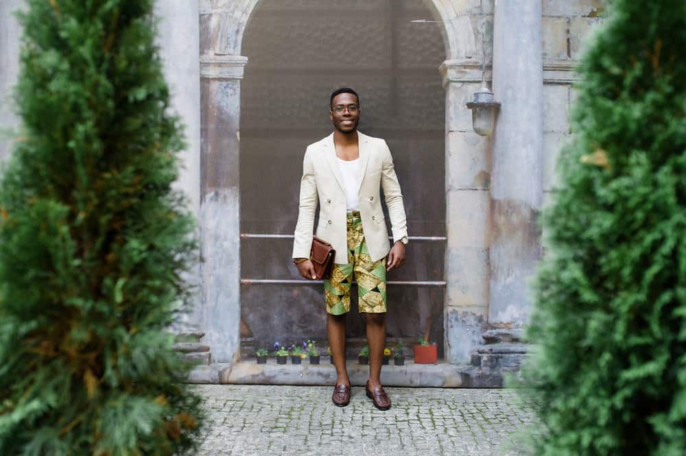 This is a man wearing blazers and colorful tailored shorts.