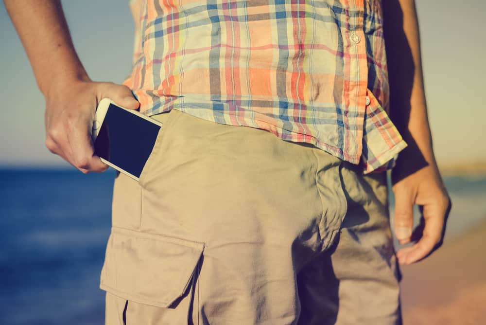 This is a close look at a man wearing a pair of khaki cargo pants.