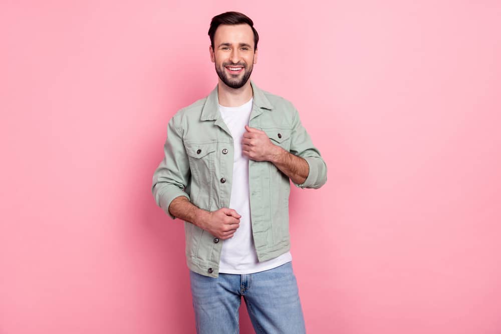 This is a man wearing a pair of jeans and matching jacket.