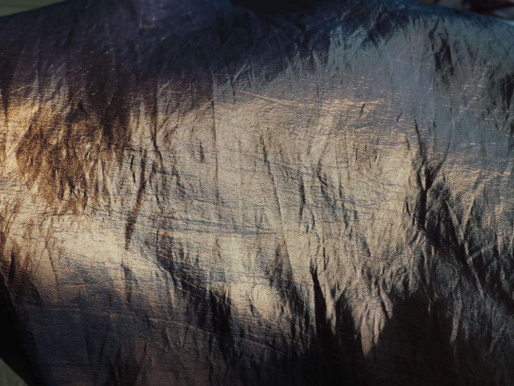 This is a close look at a black silk taffeta cloth.