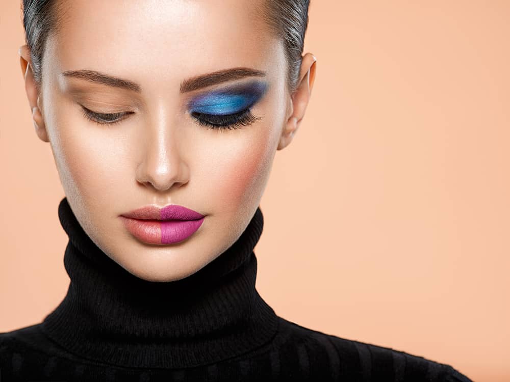 Woman with a half face makeup.