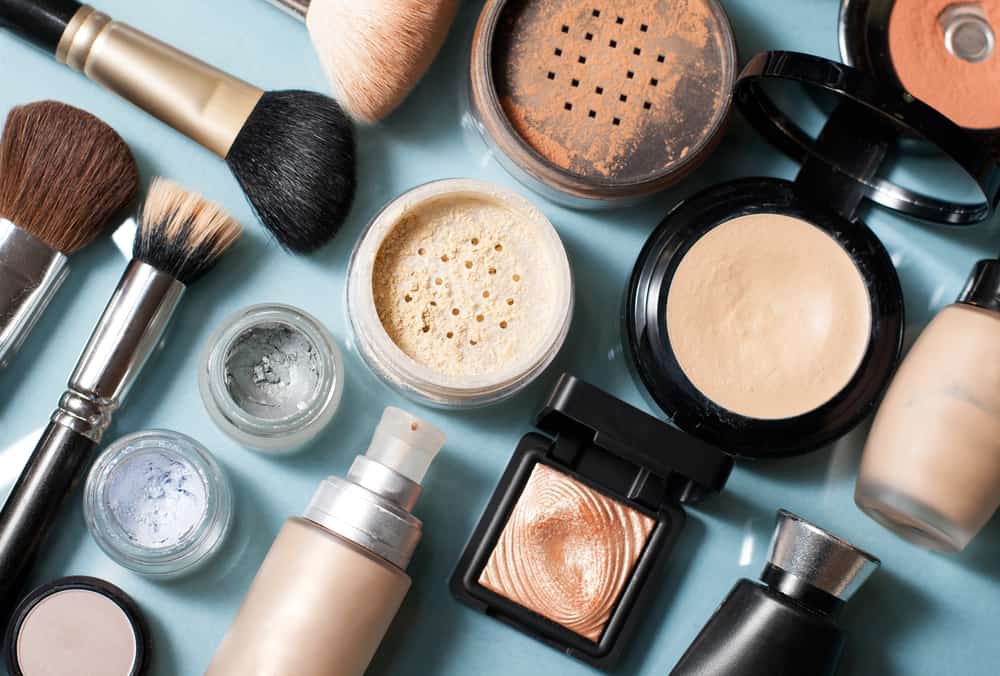 Various types of makeups against a blue background.