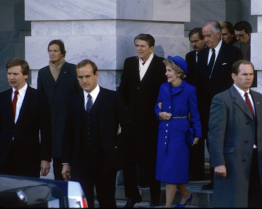 President Ronald Reagan and First Lady Nancy Reagan walk out of the US Capitol East Front Library door after Reagan renewed his Presidential oath of office.
