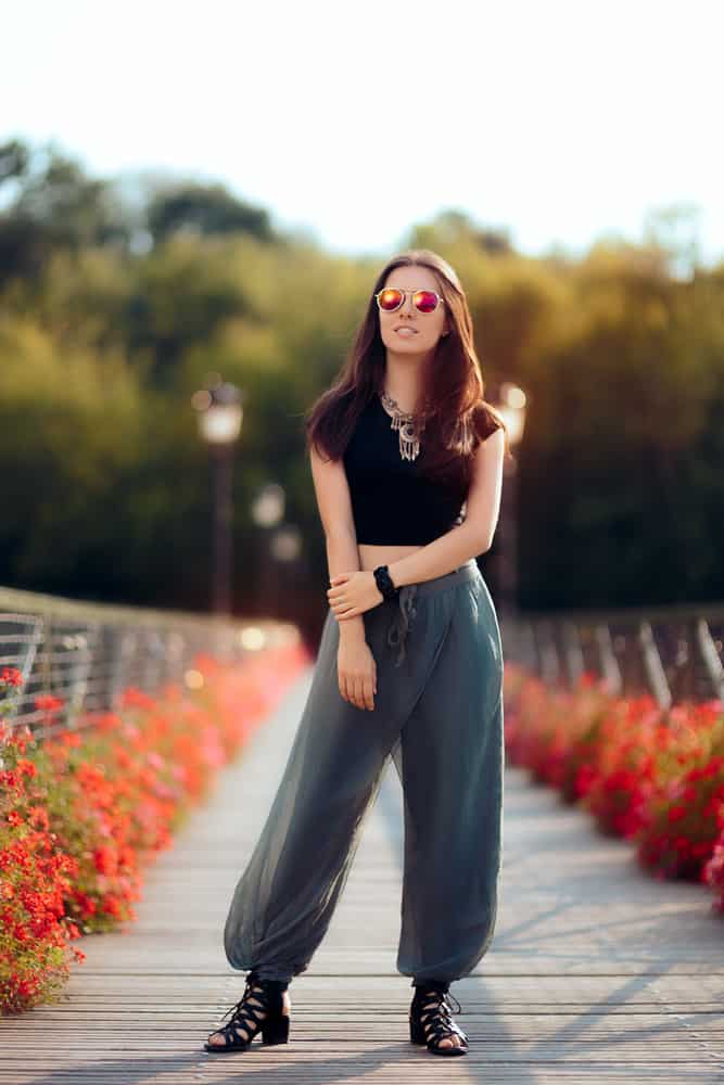This is a close look at a woman wearing a pair of harem pants.