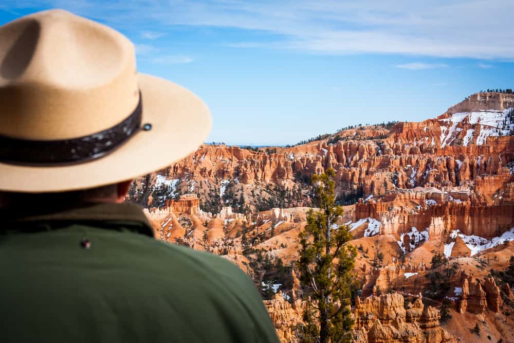 A US Park Ranger gazing at the canyon.