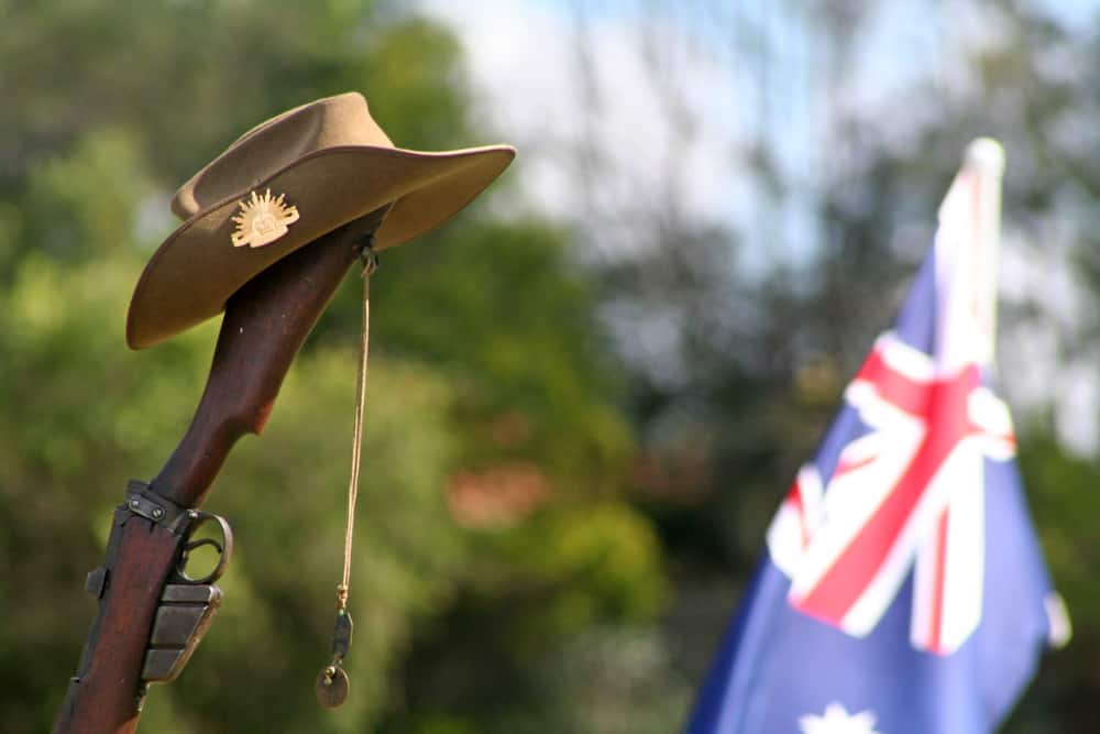 A close look at a slouch hat on a rifle.