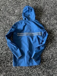 Rear view of Canada Goose rain jacket including reflectors on back, hood and cuffs